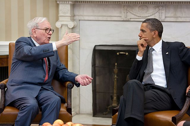 Investor Warren Buffett in deep discussion with President Obama in the White House